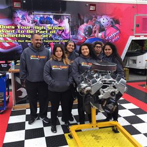 Group of 5 girls from the Team with their teacher at the competition 